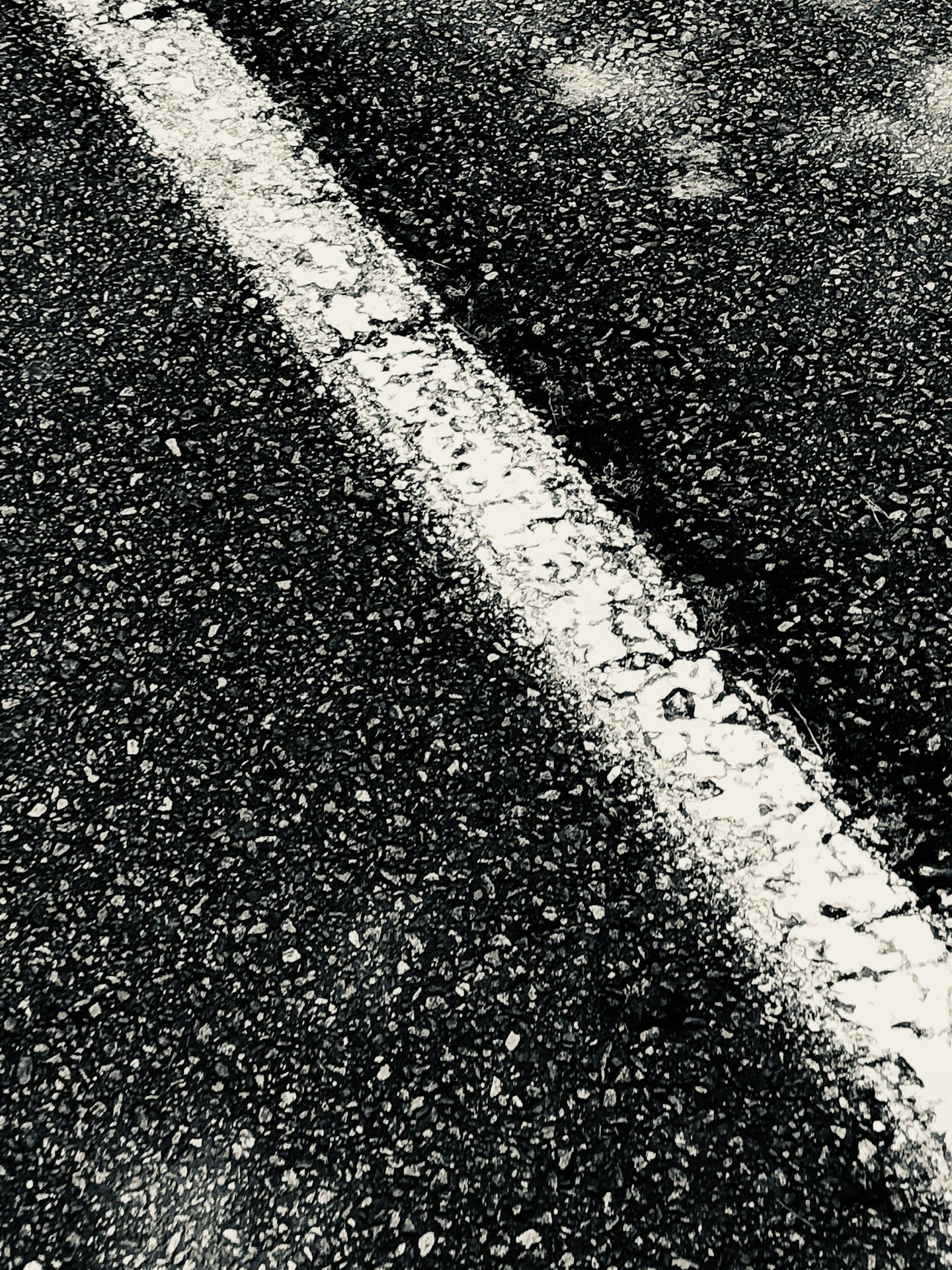 a black and white photo of an empty street